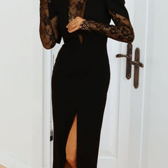 Black openwork dress with lace slit and cinched waist by Christine Brewer, featuring intricate lace details and a fitted silhouette.