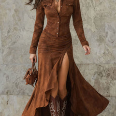 White slim-fit long dress with zippered stand-up collar and slit, by Christine Brewer, shown in the image.