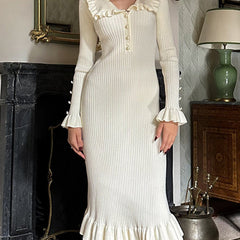 White retro ruffled knit dress by Christine Brewer, featuring a vintage-inspired design with ruffles and a fitted silhouette.