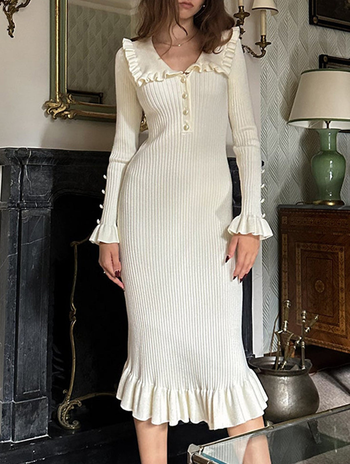 White retro ruffled knit dress by Christine Brewer, featuring a vintage-inspired design with ruffles and a fitted silhouette.