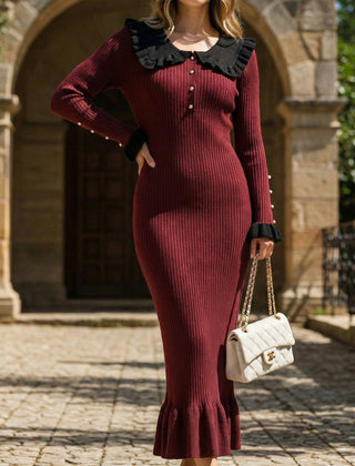 White retro ruffled knit dress by Christine Brewer, featuring a vintage-inspired design with ruffle details and a fitted silhouette.