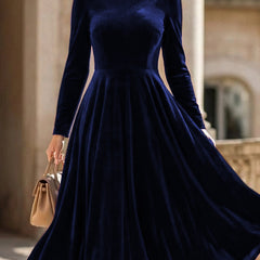 White velvet long-sleeved round neck dress by Christine Brewer, stylish and comfortable for elegant occasions.