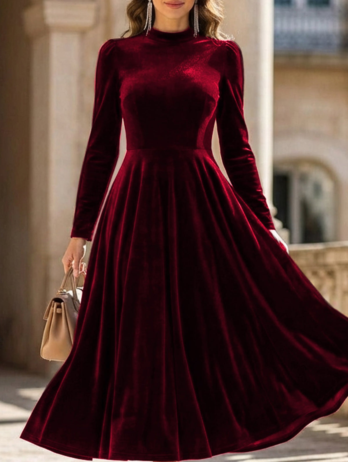 White velvet round neck long-sleeved dress by Christine Brewer, shown on a hanger against a plain background.