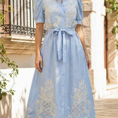 White pastoral style openwork embroidered dress by Christine Brewer, featuring delicate embroidery and a flowing silhouette.