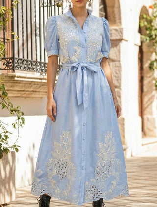 White pastoral style openwork embroidered dress by Christine Brewer, featuring delicate embroidery and a flowing silhouette.