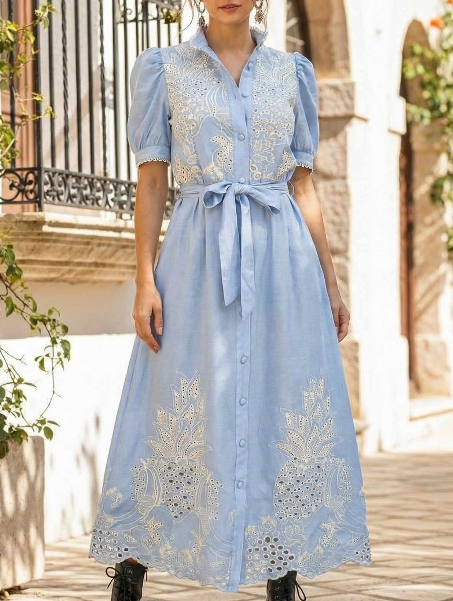 White pastoral style openwork embroidered dress by Christine Brewer, featuring delicate embroidery and a flowing silhouette.