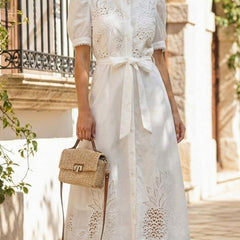 White pastoral style embroidered dress by Christine Brewer, openwork design with detailed embroidery, perfect for elegant occasions.