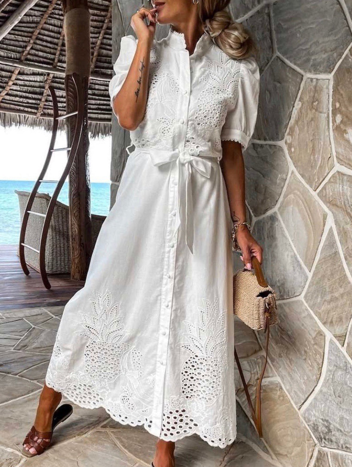 White pastoral style embroidered openwork dress by Christine Brewer, featuring delicate embroidery and openwork details.