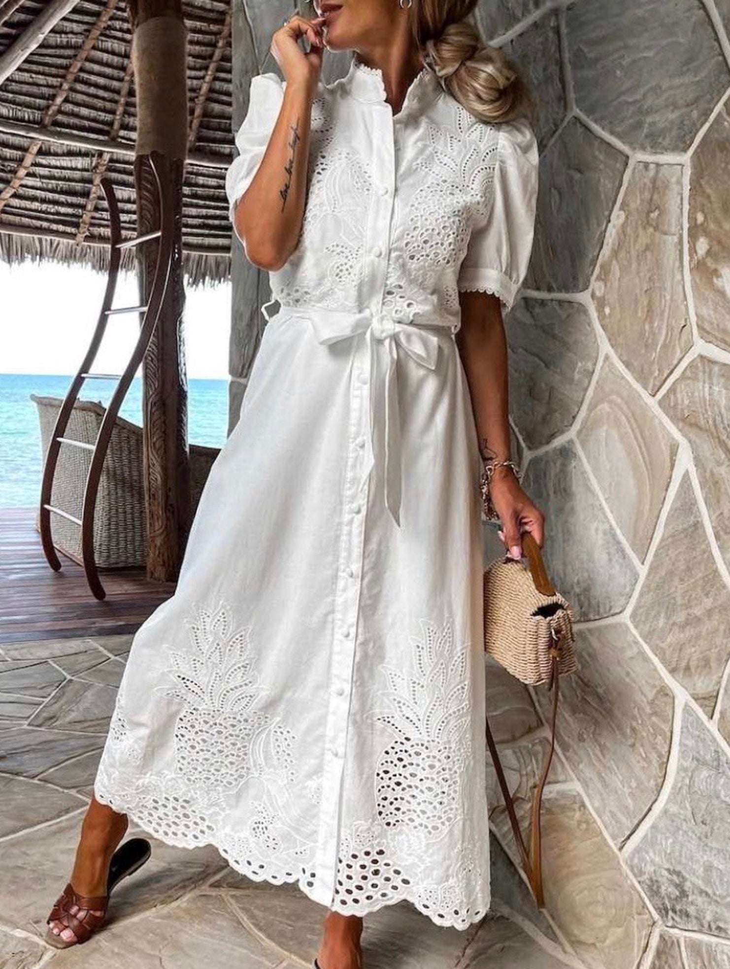 White pastoral style embroidered openwork dress by Christine Brewer, featuring delicate embroidery and openwork details.