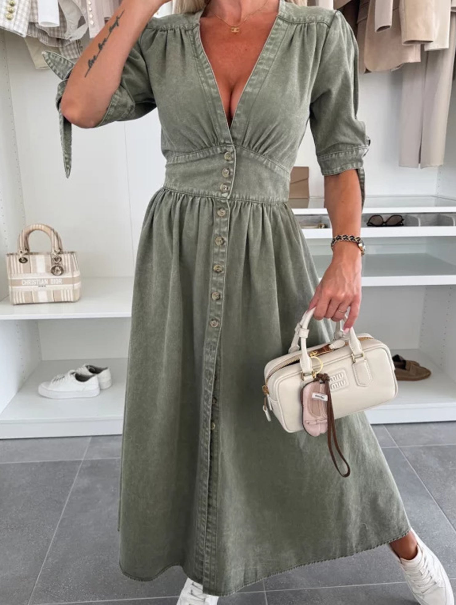 White fitted shirt dress with deep V-neck by Christine Brewer, shown in a stylish, tailored design perfect for casual or formal wear.