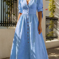 Blue fitted shirt dress with deep V-neck by Christine Brewer, showcasing a stylish and tailored design.