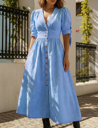 Blue fitted shirt dress with deep V-neck by Christine Brewer, showcasing a stylish and tailored design.