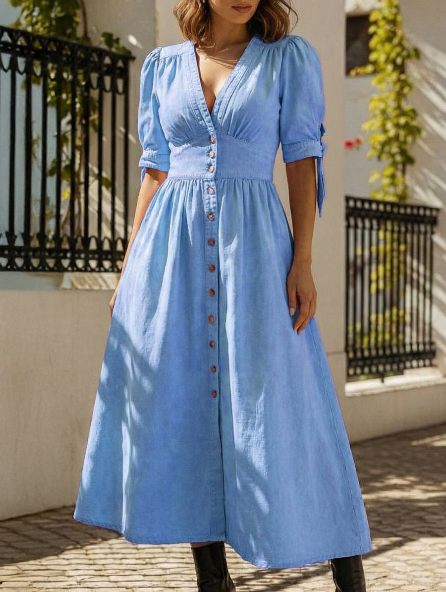 Blue fitted shirt dress with deep V-neck by Christine Brewer, showcasing a stylish and tailored design.