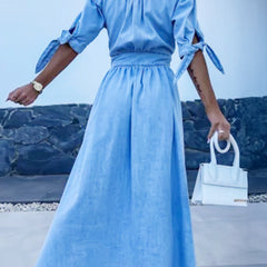 Blue deep V-neck fitted shirt dress by Christine Brewer, stylish and elegant with tailored design and crisp fabric.
