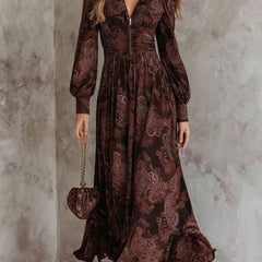 White retro long-sleeved V-neck fitted waist dress by Christine Brewer, shown on a mannequin with a classic silhouette.