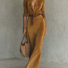 White suede long dress with fitted waist and belt by Christine Brewer, showcased on a hanger.