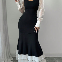 Black colorblock long sleeve mermaid dress by Christine Brewer, featuring a fitted silhouette and elegant design.