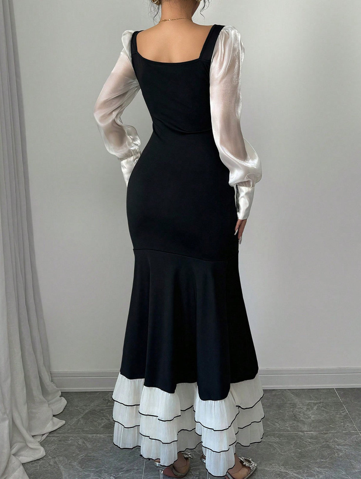 Black colorblock long sleeve mermaid dress by Christine Brewer, featuring a fitted silhouette and stylish design.