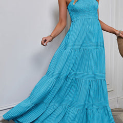 Blue retro style striped maxi dress by Christine Brewer, flowing white dress with bold stripe patterns, perfect for casual or summer wear.