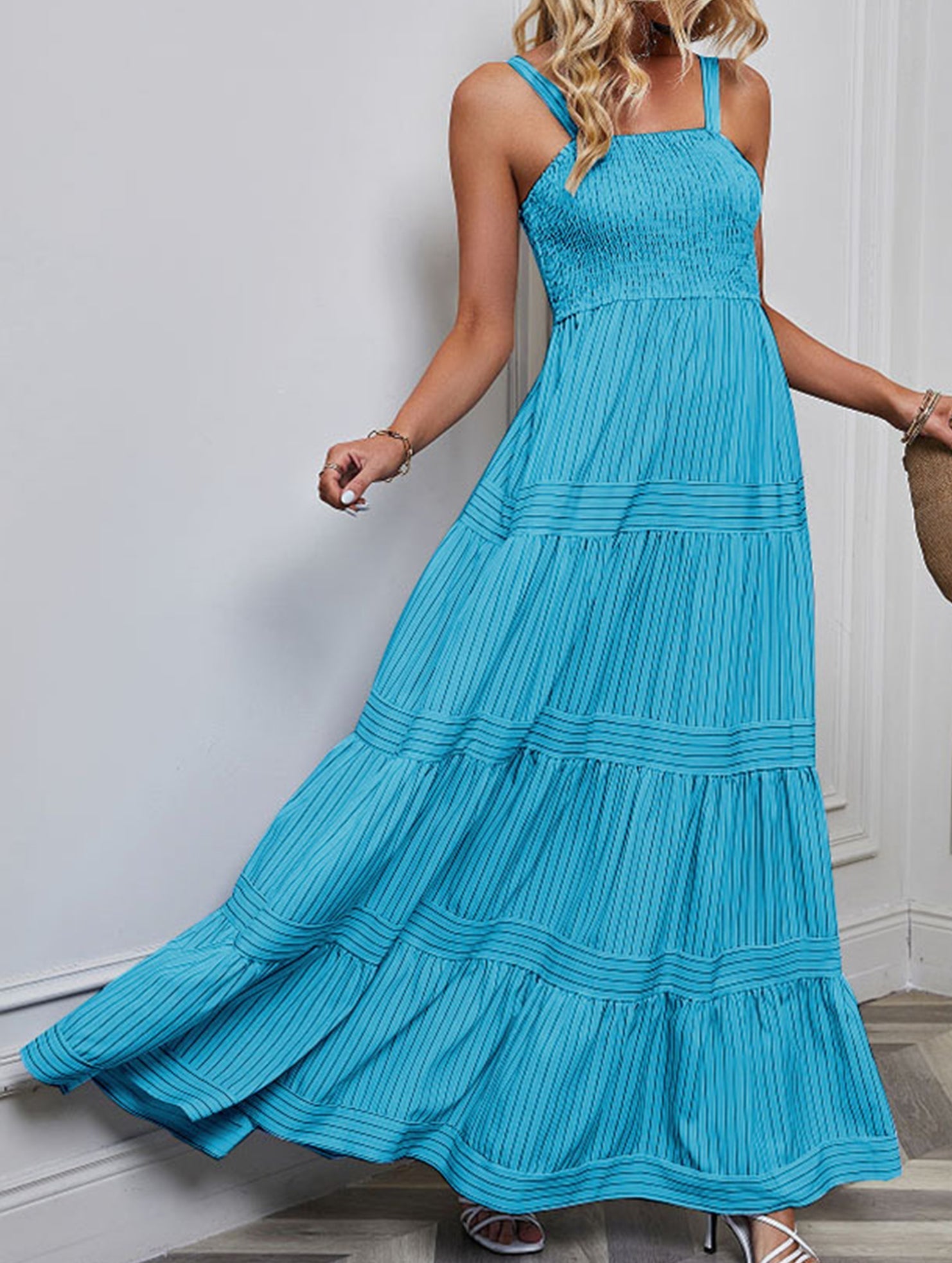 Blue retro style striped maxi dress by Christine Brewer, flowing white dress with bold stripe patterns, perfect for casual or summer wear.