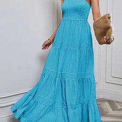 Blue retro striped maxi dress by Christine Brewer, flowing design with bold horizontal stripes, perfect for casual or summer wear.