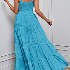 Blue and white striped retro maxi dress by Christine Brewer, flowing design with a fitted waist and sleeveless style.