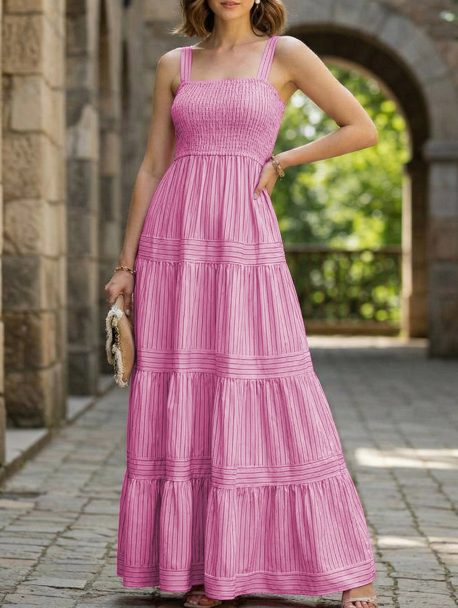 Pink striped retro maxi dress by Christine Brewer, flowing white dress with bold vertical stripes, perfect for summer wear.