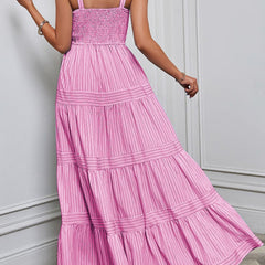 Pink retro striped maxi dress by Christine Brewer, featuring a flowing design and bold horizontal stripes.
