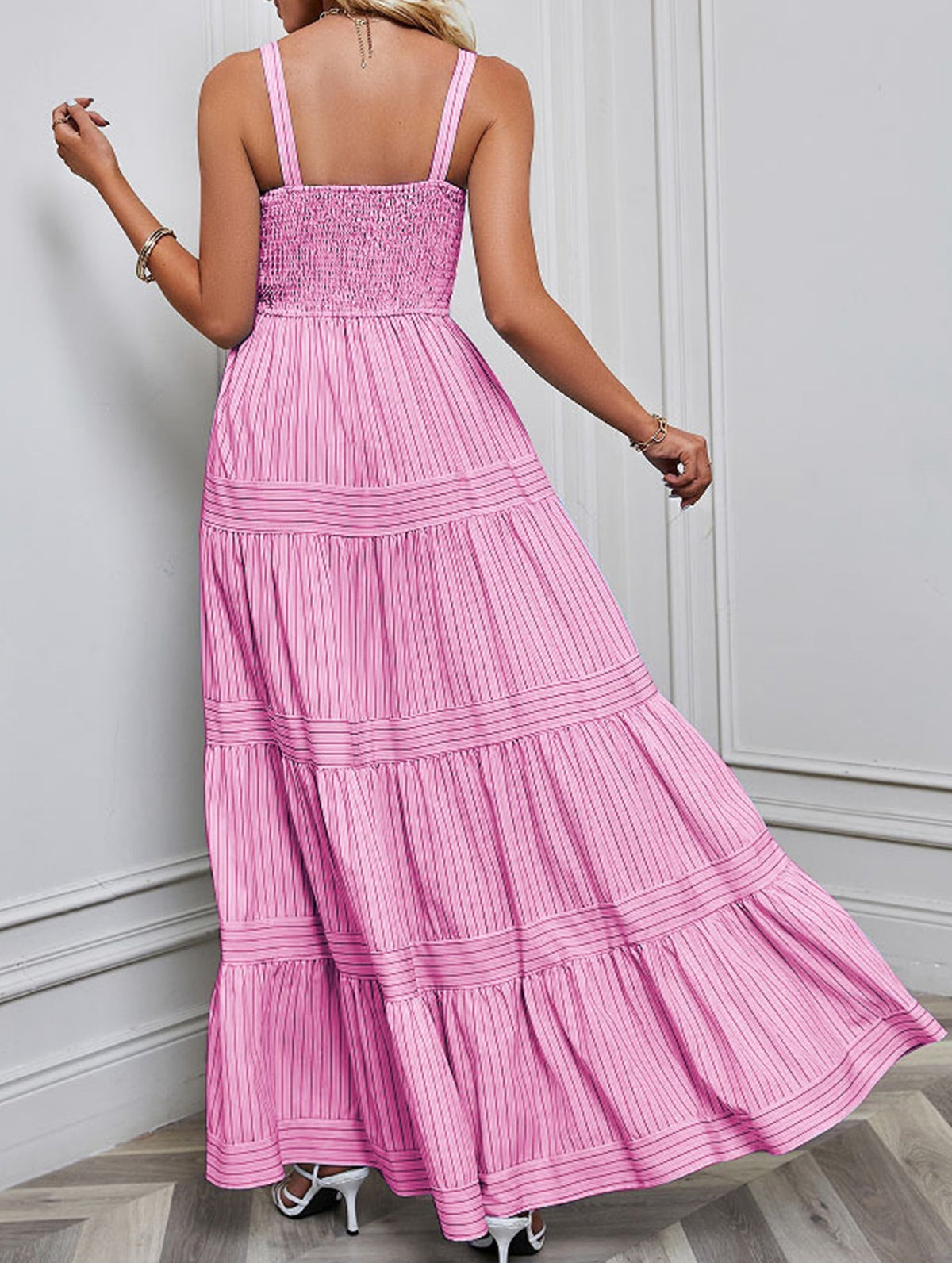 Pink retro striped maxi dress by Christine Brewer, featuring a flowing design and bold horizontal stripes.