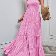 White retro striped maxi dress by Christine Brewer, flowing fabric, sleeveless design, and bold pattern perfect for summer days.
