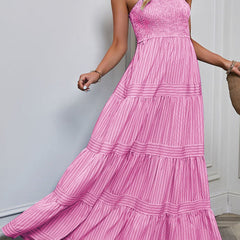 Pink retro striped maxi dress by Christine Brewer featuring a flowing silhouette and bold horizontal stripe pattern.