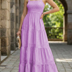 Purple retro striped maxi dress by Christine Brewer, featuring a flowy silhouette and bold vertical stripes.