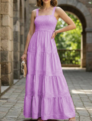 Purple retro striped maxi dress by Christine Brewer, featuring a flowy silhouette and bold vertical stripes.