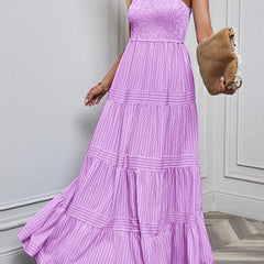 Purple retro style striped maxi dress by Christine Brewer, flowing fabric, featuring bold horizontal stripes and a fitted waist.