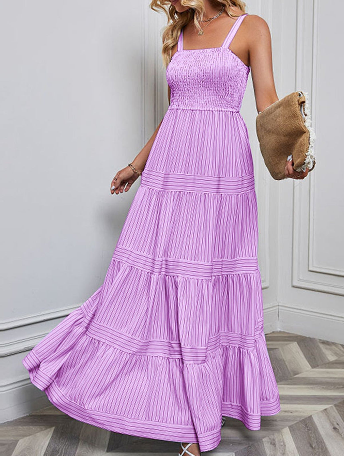 Purple retro style striped maxi dress by Christine Brewer, flowing fabric, featuring bold horizontal stripes and a fitted waist.
