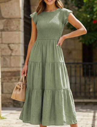 White cross-border sleeved dress by Christine Brewer, featuring a solid color design and stylish, modern silhouette.