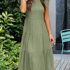 White cross-border sleeved dress by Christine Brewer, featuring solid color design and elegant fit, shown on a model.