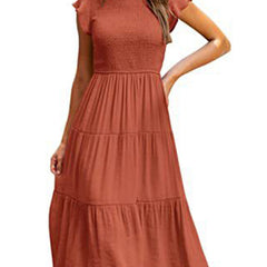 White cross-border sleeved dress by Christine Brewer, showcasing a simple, elegant design with solid color fabric.