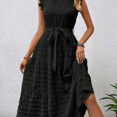 Black ruffled flutter sleeve tie textured dress by Christine Brewer, featuring a stylish design and elegant silhouette.