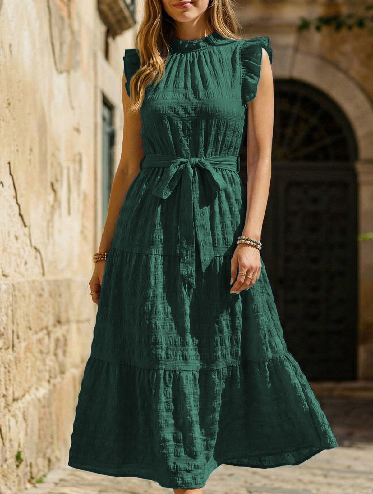 White textured dress with ruffled flutter sleeves and tie waist by Christine Brewer, shown on a model.