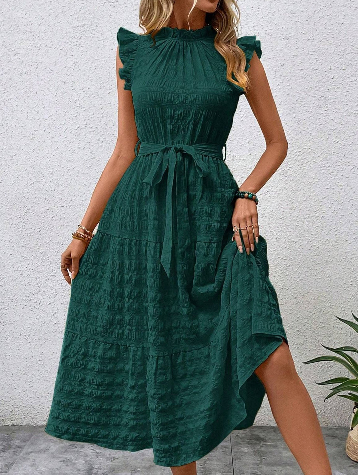 White ruffled flutter sleeve dress by Christine Brewer with tie waist and textured fabric, perfect for elegant casual wear.