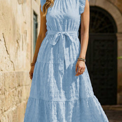 Light blue ruffled flutter sleeve tie textured dress by Christine Brewer, showing the stylish design and fabric details.
