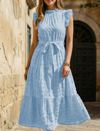 Light blue ruffled flutter sleeve tie textured dress by Christine Brewer, showing the stylish design and fabric details.