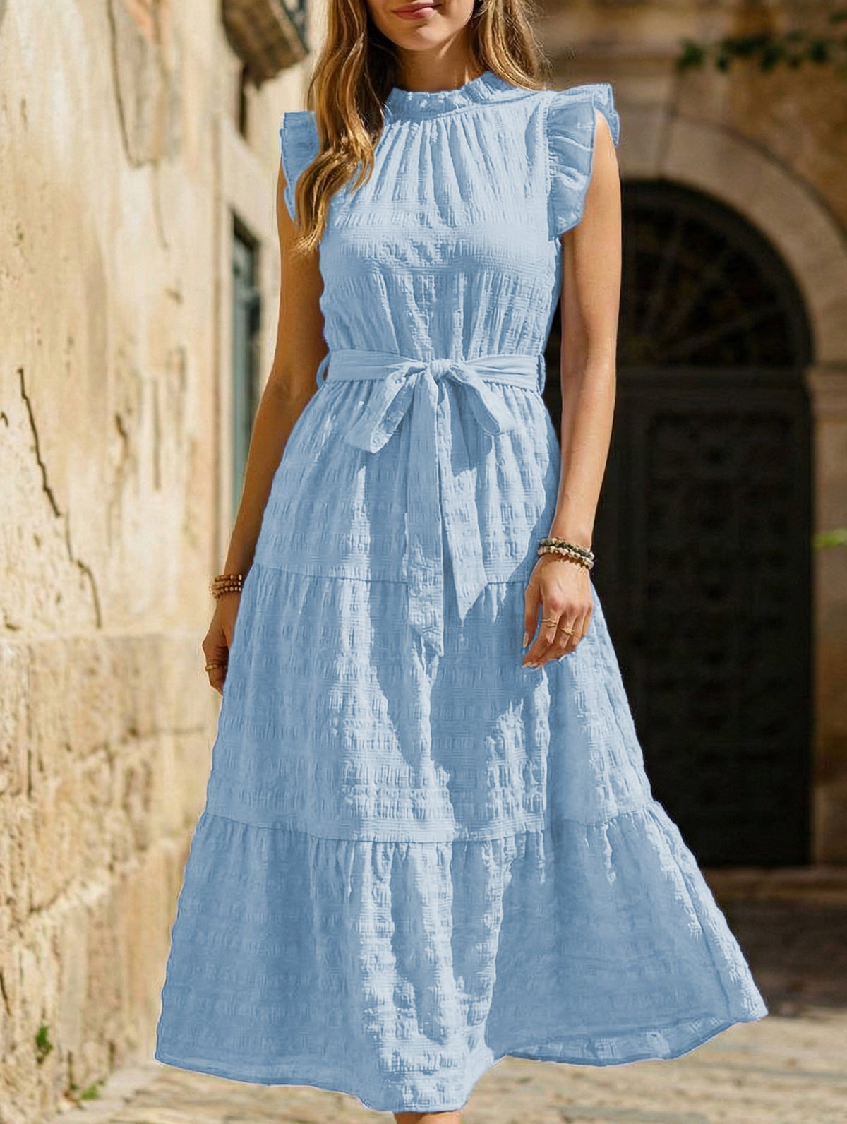 Light blue ruffled flutter sleeve tie textured dress by Christine Brewer, showing the stylish design and fabric details.