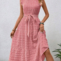 White ruffled flutter sleeve tie textured dress by Christine Brewer displayed on a model.