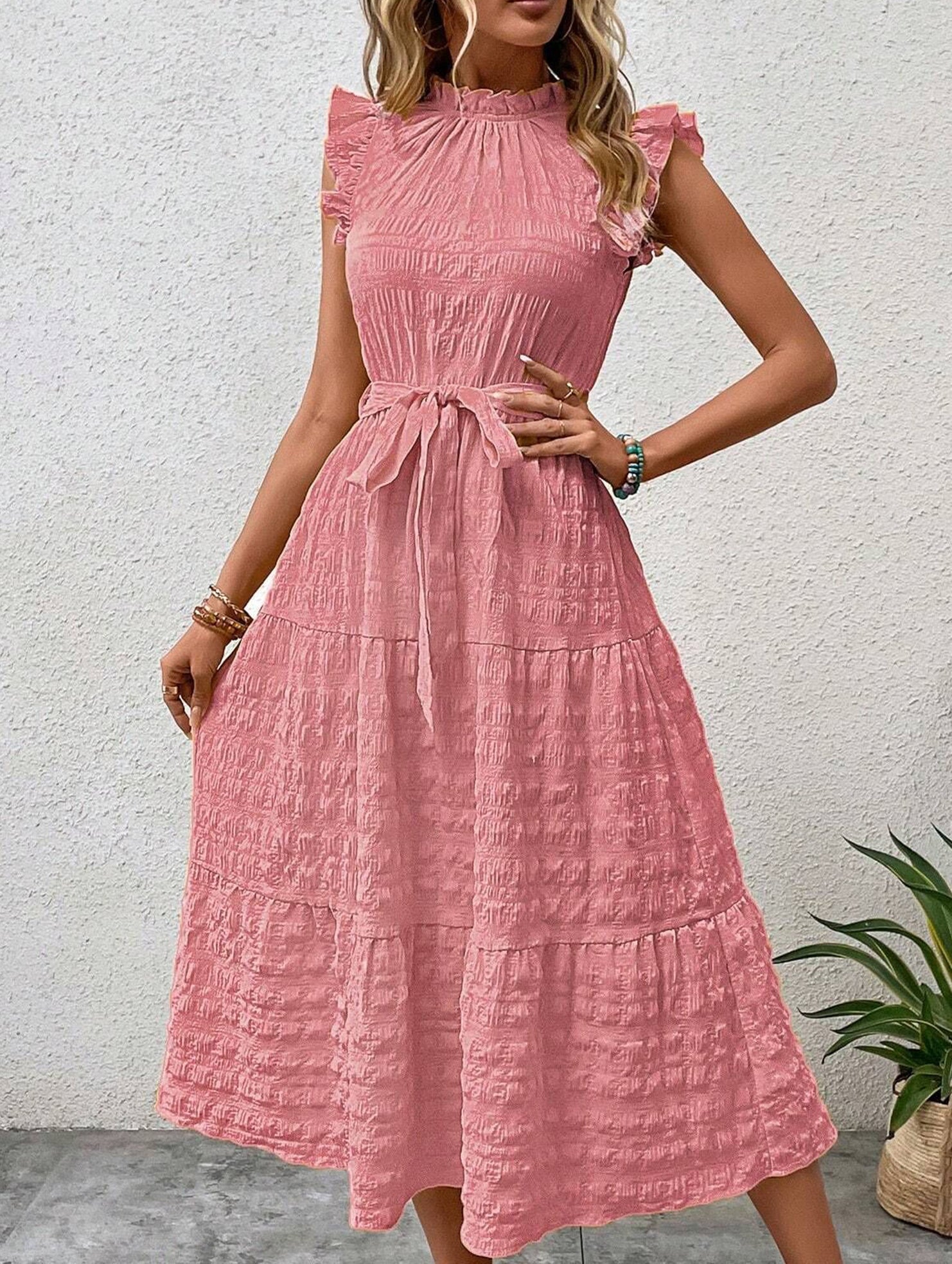 White ruffled flutter sleeve dress by Christine Brewer featuring tie waist and textured fabric, stylish and feminine for all occasions.