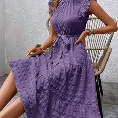 Purple textured dress with ruffled flutter sleeves and tie waist by Christine Brewer, showcasing a stylish and elegant design.