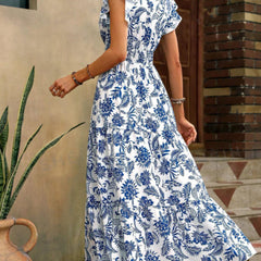 Blue print V-neck dress by Christine Brewer featuring a stylish design, perfect for casual or semi-formal occasions.