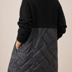 Long quilted puffer jacket for women by Christine Brewer, featuring a stylish design and padded insulation for warmth.