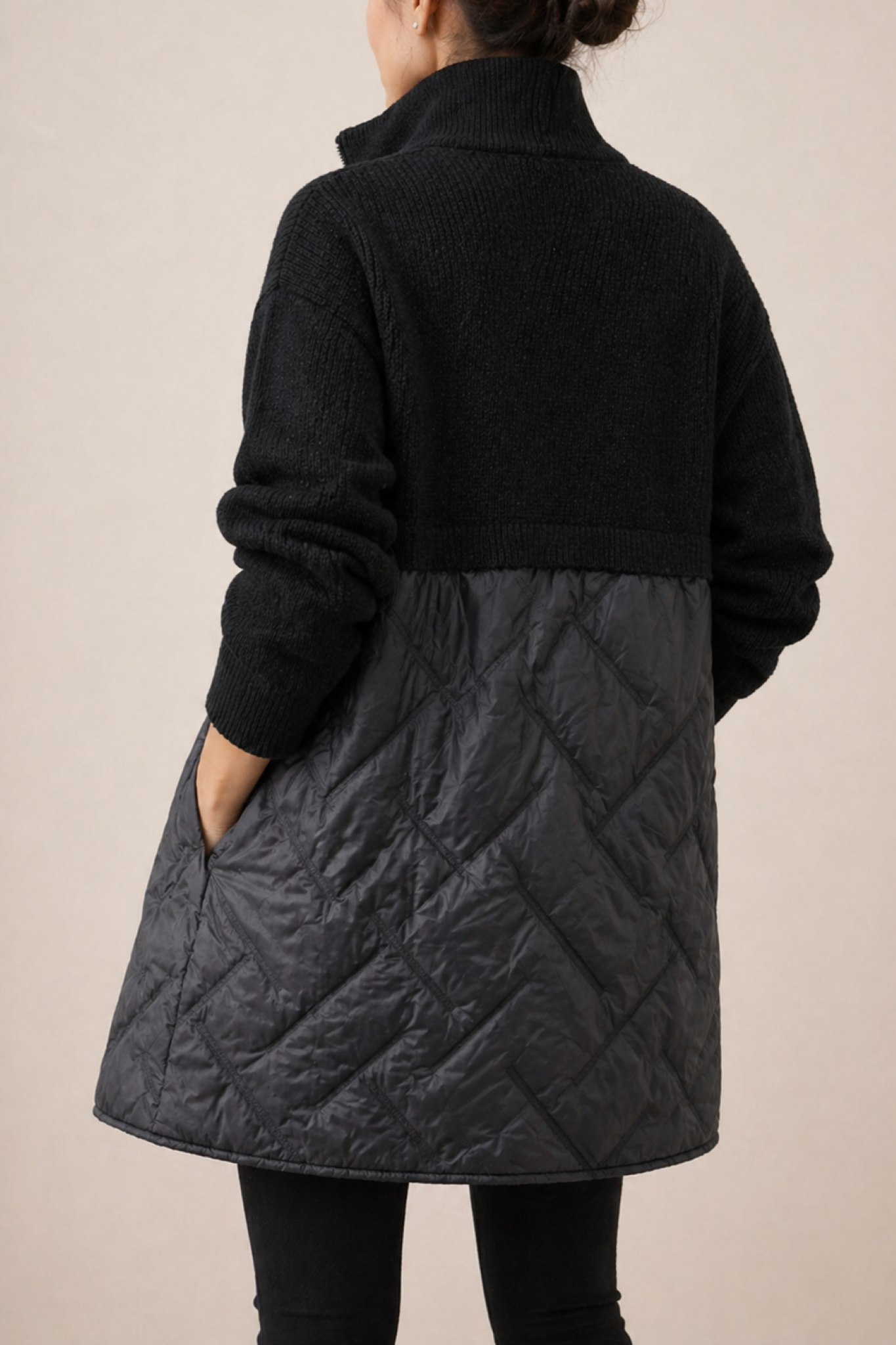 Long quilted puffer jacket for women by Christine Brewer, featuring a stylish design and padded insulation for warmth.